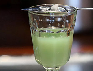 Glass of absinth with spoon and sugar cube